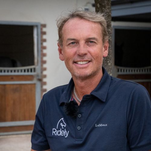 Profile image of Carl Hester smiling together with his Olympic ride En Vogue.